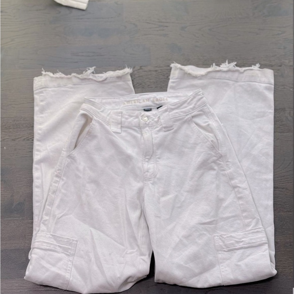 Baggy white jeans, by American Eagle. Could be high or low rise.
